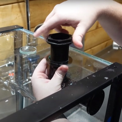 Cory_screwing_in_bulkhead_fitting
